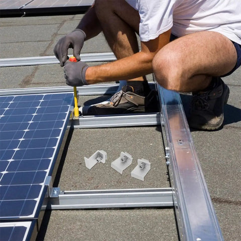 Installation of Rock Solid Heavy Duty Aluminum Solar Panel Clamps 12 Piece Set on rooftop with M8x25 hex screws.