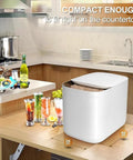 Self Cleaning Portable Countertop Ice Maker Spits Out Nine Bullet Cubes In Six Minutes With Smart Touch Panel And Two Liter Tank Perfect For Home Bars Offices And Rv Hangouts No Drama Just Frosty Vibes on kitchen countertop with drinks