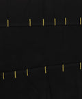 Close-up of Multi Functional Chef Knife Roll Bag With Pockets and Handle showing black fabric and yellow stitching.