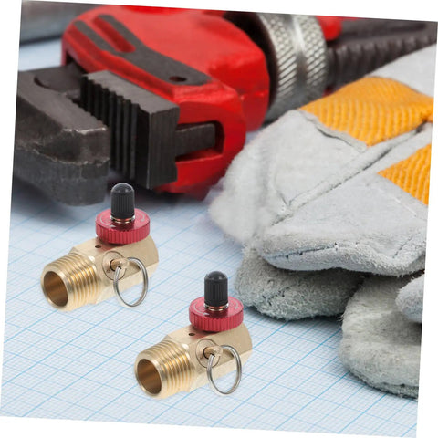 Rock Solid Brass Safety Valve For Air Tank Manifold With Fill Port And Npt Hose Valve Compressor Accessory For Safe Inflation And Pressure Control Built Tough Hella Reliable Two Pack with red knobs and tools in background.