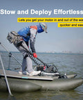 Man stowing Badass 55 Lb Thrust Electric Bow Mount Trolling Motor on inflatable boat for quick deployment on water.