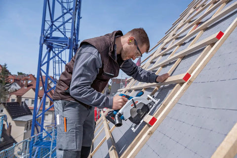 Man using Badass 18V Cordless Brushless Circular Saw With Slick Six Point Five Inch Blade on a roof for precision cuts.
