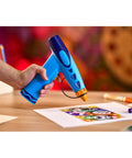 Rad Battery Powered Airbrush Marker Spray Craft Kit Smooth Glide Washable Ink Pens Plus Five Reusable Design Stencils Vibes hand holding blue airbrush on art