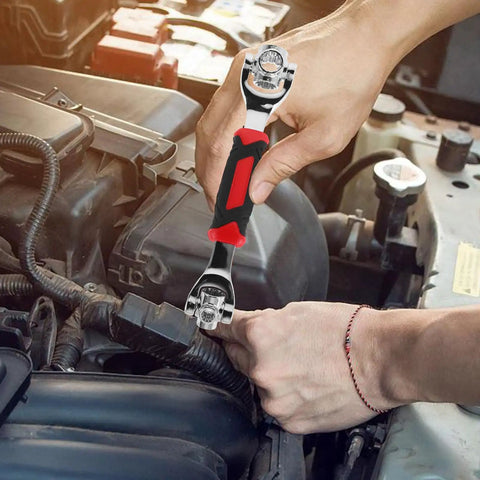 Universal Socket Wrench 48 In 1 With Rotating Head Multi Bit Fastener Tool Heavy Duty Home Repair Kit in use on a car engine.