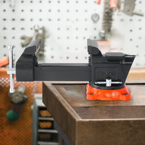 5 Inch Bench Vise With 360 Degree Swivel Locking Base And Anvil, Beefy Heavy Duty Ductile Iron Construction, 2.8 Inch Throat, Clamps Round Pipes, Multipurpose Workbench Vise For Home Shop And Pro Projects on a wooden bench