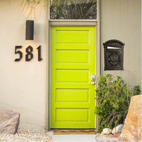 Outdoor Metal Wall Mounted Mailbox with Vintage Cast Iron Locking Look Old School Charm next to bright green door