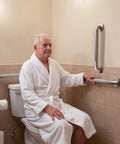 Super Sturdy 24 Inch Stainless Steel Shower Grab Bar That Actually Holds Tight Wall Mounted Bathroom Safety Rail For Seniors Heavy Duty Non Slip Supportive Handrail Straight Up Reliable installed near toilet with senior using it.