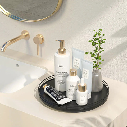 Rock Solid 12 Inch Black Oak Lazy Susan Turntable Tray with bathroom products on countertop for organized storage.