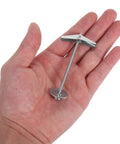Hand holding 15 Pack Heavy Duty Toggle Bolts For Drywall With Wing Nut Kit Carbon Steel Hollow Wall Anchors For Cement Fiberboard