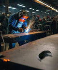 Heavy Duty Wrap Around Safety Glasses For Welding And Grinding With Impact Resistant Polycarbonate Lenses showing on a work table.