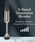 Hella Powerful Immersion Blender With Five Speed Settings And A 625-Watt Motor That Handles Whole Foods And Creates Creamy Soups Smoothies And Baby Food In Sleek Stainless Steel Finish on a marble surface.
