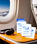 Alcohol Free Electronic Cleaning Wipes, 100 Individually Wrapped, displayed on airplane tray with headphones.
