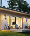 Heavy Duty Solar Wall Lamp With Rotating Red White Blue LED Stripes Waterproof Retro Barber Shop Decorative Glow mounted on a house wall.