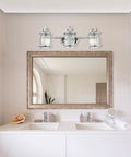 Three Light Vanity Light In Chrome With Ribbed Seeded Glass Shades For A Coastal Bathroom Vibe above a modern double sink