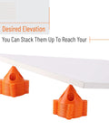 Painters Pyramid Stands 20 Pack for Canvas Elevation and Pouring, shown stacked under white board for elevation demo