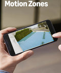 Person adjusting customizable motion zones on phone for Spotlight Cam Pro Battery Security Camera For Home Or Business With Retinal 2K Video, Color Night Vision, Two Way Talk, HDR Imaging, 3D Motion Detection, And Dual Band WiFi For Quick Setup And Reliable Protection.