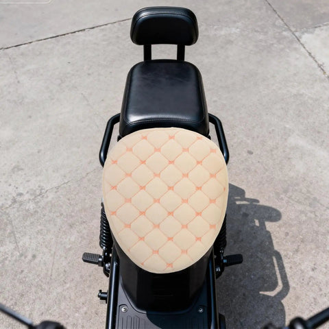 Hella Cozy Beige Plush Motorcycle Seat Cover With Super Warm Winter Fluffy Padding For Riders Seekin a Smooth Ride on black bike seat.