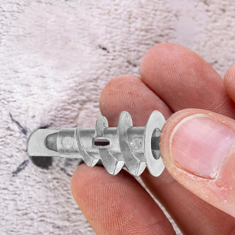 Close-up of Heavy Duty Drywall Anchors And Screws Kit self-drilling hollow wall anchor in zinc alloy held by fingers.