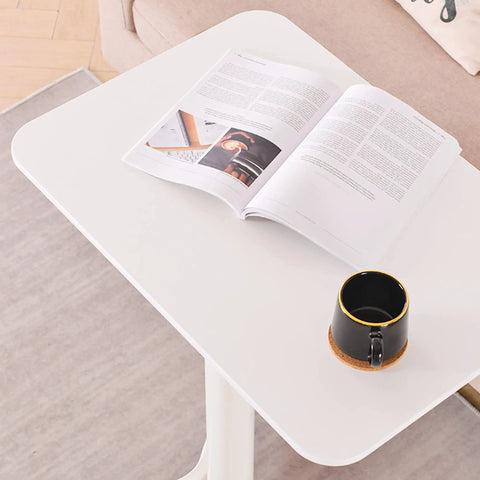 Rock Solid Adjustable Lectern Podium Stand With Expansive Desktop Board Built Tough For Daily Grind Provides Smooth Height Adjustments with open magazine and coffee cup.