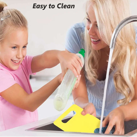 Higoney 17-piece kids kitchen set, plastic utensils with yellow cutting board, front view at sink being rinsed.