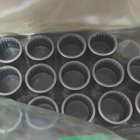 One Way Needle Roller Clutch Bearing With Drawn Cup Construction For HFL3530-L564 Specs, showing multiple bearings in a tray.
