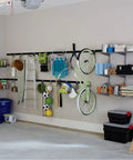 Must Have FastTrack Garage Hook Set 6 Pack Heavy Duty Powder Coated Metal Hangers For Ladders Tools Ropes Hoses Bikes And More Installs On Rails Easily Holds Up To 25 Lbs Each holding various garage items on wall