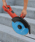 Badass 3000W 14 Inch Electric Concrete Saw With Built In Water Pump cutting concrete steps with diamond blade.
