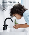 Child washing hands under Matte Black 8 Inch Widespread Bathroom Faucet With 3 Holes 2 Handles, 360 Degree Rotating Spout