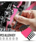 Hand using 54 Piece Pink Tool Kit For Women Newbies DIY Home Repair Tools Set's Allen key on bike, pink toolbox visible