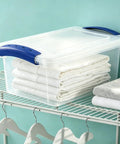 Pack Of Three 7 Quart Clear Plastic Storage Bins Featuring Heavy Duty Walls And Foolproof Snap Lock Lids To Keep Garage Or Desk Clutter Totally Under Control For Busy Mornings with folded towels.
