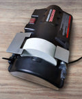 Low Speed Knife Sharpener With Wet And Dry Grinding Wheel 0.7 Amp, Easy To Use, Multi Angle Sharpening on wooden table