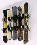 Heavy Duty Wall Mounted Ski And Snowboard Rack Featuring Five Slick Storage Hooks Badass Garage Space Organizer with snowboards neatly stored.