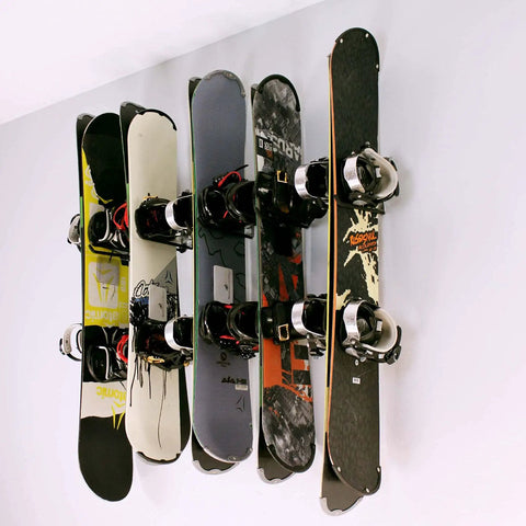 Heavy Duty Wall Mounted Ski And Snowboard Rack Featuring Five Slick Storage Hooks Badass Garage Space Organizer with snowboards neatly stored.