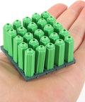 Green Plastic Drywall Anchor Kit With Self Tapping Screws held in hand showing size and detail