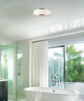 Chloe 15 Inch Modern Semi Flush Ceiling Light With White Fabric Drum Shade Three Light Fixture Featuring Tempered Glass Diffuser And Chrome Finish For Kitchen And Hallway Vibe in a bright bathroom setting.