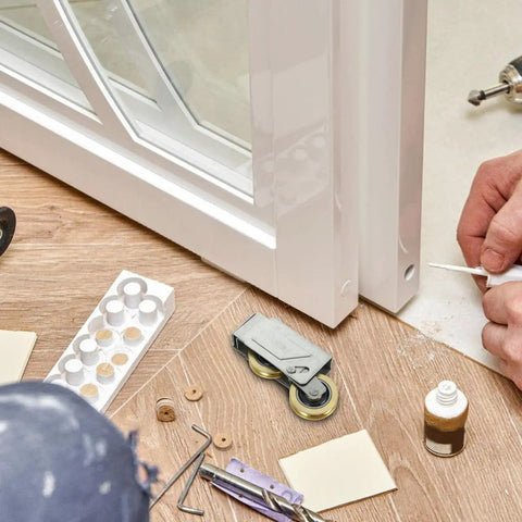 Heavy Duty Door Pulley And Sliding Roller Featuring Dual Copper Wheels Plus Precision Ball Bearings For Quiet Window And Patio Door Replacement Hardware That Works Like A Charm beside a window during installation.