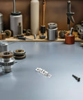 Copper Ball Door Catch Cabinet Latch Hardware Set 50mm Silver Roller Catch placed on workbench with tools