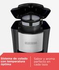 Compact Single Serve Coffeemaker in black showing open lid with permanent filter, built for small kitchens and dorm rooms.