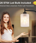 Gold Floor Lamp Tall Standing Light With Clear Glass Shade For Living Room And Bedroom displayed next to model in a room
