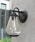 Sharp Badass Hella Waterproof Outdoor Wall Lantern With Slick Clear Glass Shade And Tough Diecast Aluminum Build For Front Porch Or Backyard Vibes Fits E27 Right Now Tonight mounted on gray wall.