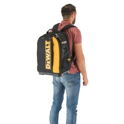 Massive 40 Liter Tool Backpack Built Tough As Nails For Contractors carried by a man, showcasing padded straps and durable material.