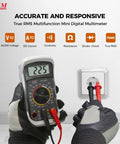 Versatile Digital Multimeter 600 Volt AC DC Voltage Meter with Backlit LCD Display testing outlet, gloves visible