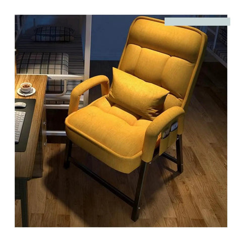 Comfortable yellow upholstered armchair with cushion, perfect for relaxation in a cozy workspace or living area.