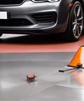 Compact Automatic Aerosol Fire Extinguisher Kit For Car Engines And Garages near a car, highlighting two self activating fire suppressors.