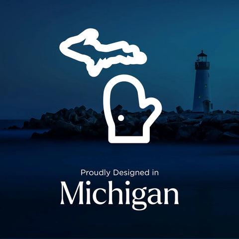 Graphic of Michigan shape with mitten, lighthouse in background, text reading 'Proudly Designed in Michigan'.