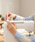 Large Thread Spool Stand For Sewing Machines being added to a white sewing machine, showcasing easy installation for thread.