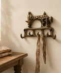 Slick Vintage Cast Iron Sewing Machine Wall Hook Rock Solid For Hanging Coats And Everyday Keys with rustic ribbon.