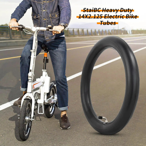 40 Percent Thicker 14x2.125 Inner Tubes Heavy Duty Tough As Nails 14 Inch Tire Tubes For Electric Scooters And E Bikes Replacement CR202 Angled Valve Stem 2 Pack For Easy Mounting And Long Lasting Performance beside a person riding an electric bike.