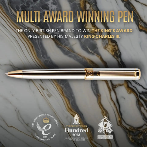 Luxurious Silver Chrome Ballpoint Pen With Real Gold Plating And Schmidt Black Refill on marble background