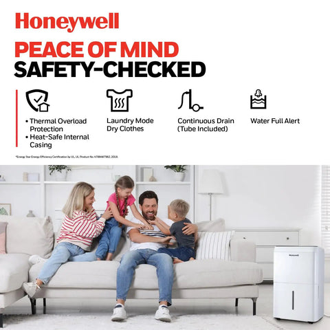 Top Tier 32 Pint Energy Star Dehumidifier For Big Homes And Damp Basements With Smart Auto Controls next to family on couch.